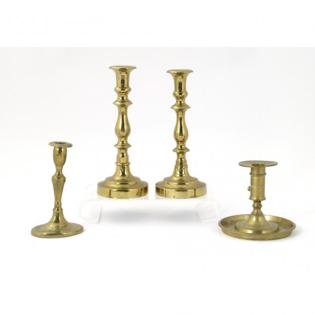four-early-antique-brass-candlesticks
