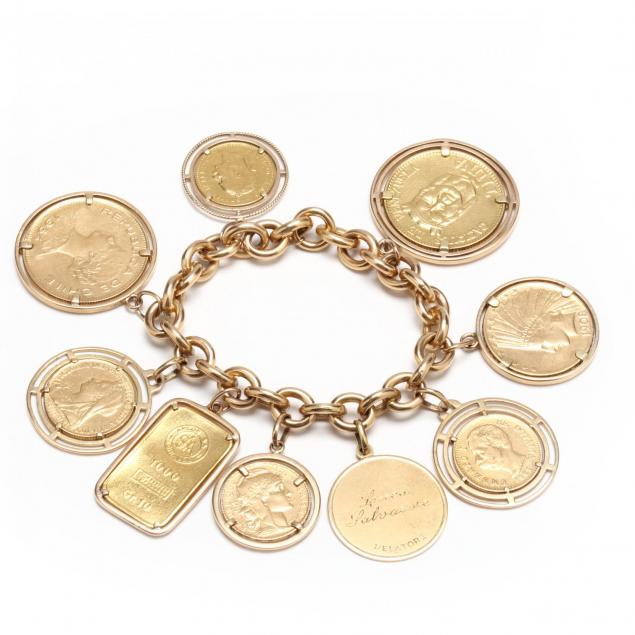an-18kt-gold-bracelet-with-a-gold-charm-a-gold-bar-and-seven-gold-coins