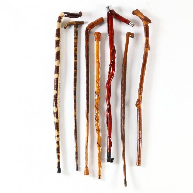 a-group-of-folk-art-walking-sticks
