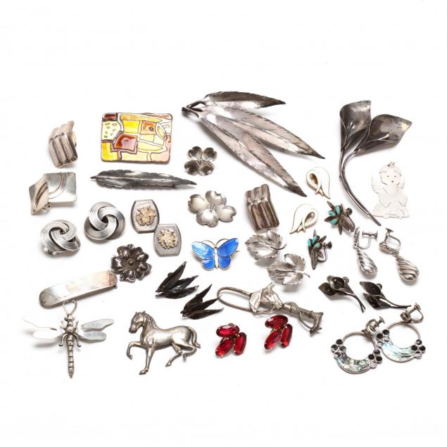 large-group-of-silver-earrings-and-brooches