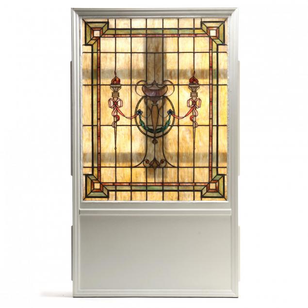 antique-classically-decorated-stained-glass-window-in-lighted-frame