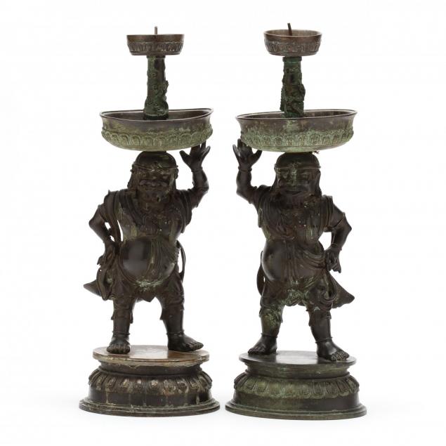 a-rare-pair-of-chinese-bronze-foreigner-pricket-candlesticks