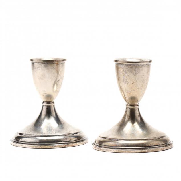 a-pair-of-sterling-silver-candlesticks