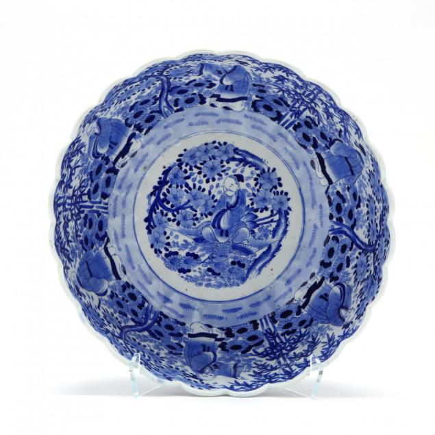 a-blue-and-white-punch-bowl-with-scalloped-rim