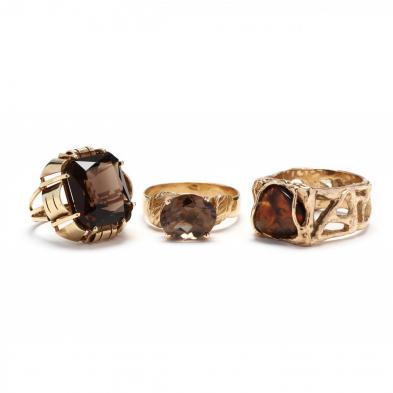 three-gold-and-gemstone-rings