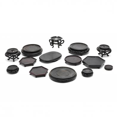 a-group-of-14-assorted-black-asian-wooden-stands
