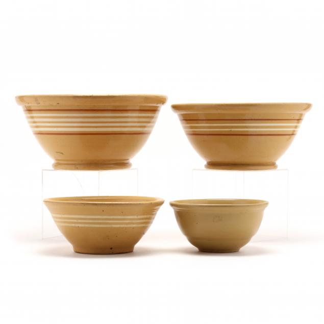 a-graduated-group-of-antique-yellow-ware-bowls