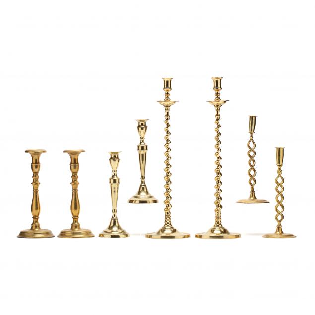 four-pairs-of-antique-brass-candlesticks