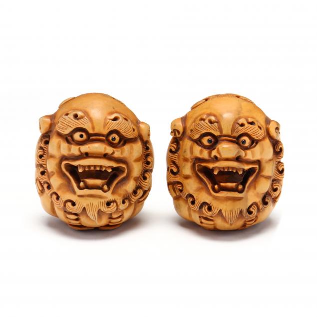 a-pair-of-carved-japanese-wood-shishi-lion-netsukes