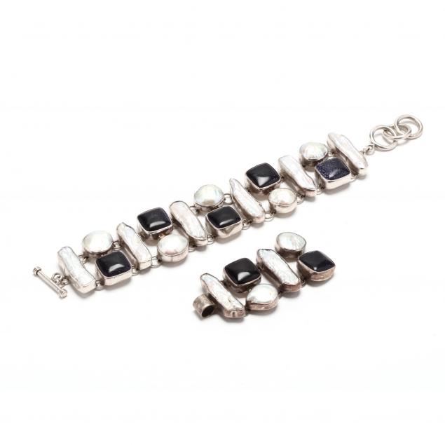 a-silver-gem-set-bracelet-and-pendant