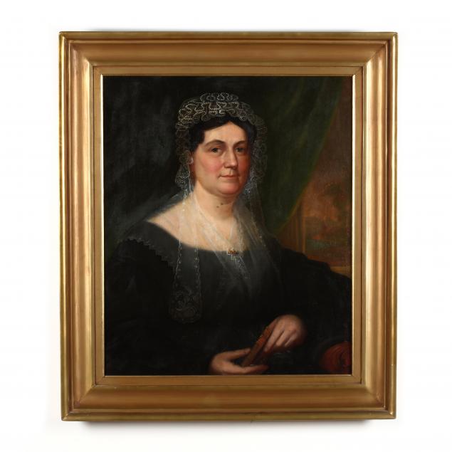 american-school-19th-century-portrait-of-a-woman-holding-the-new-testament
