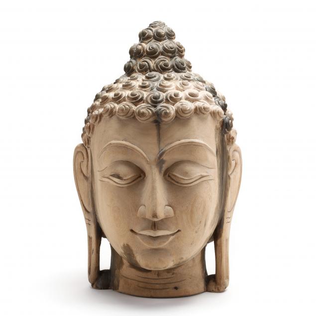 a-large-carved-wooden-buddha-head