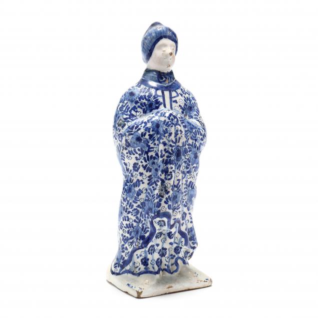 a-blue-and-white-delft-figure-of-a-lady