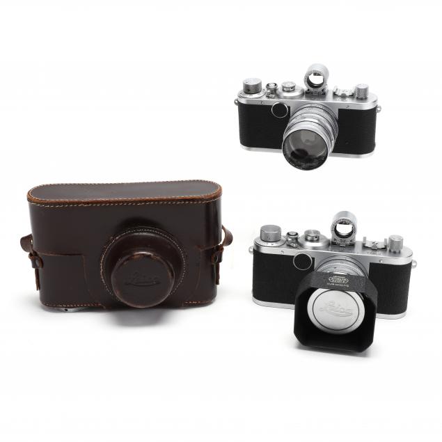 two-vintage-leica-d-r-p-leitz-wetzlar-rangefinder-cameras-with-lenses-and-viewfinders