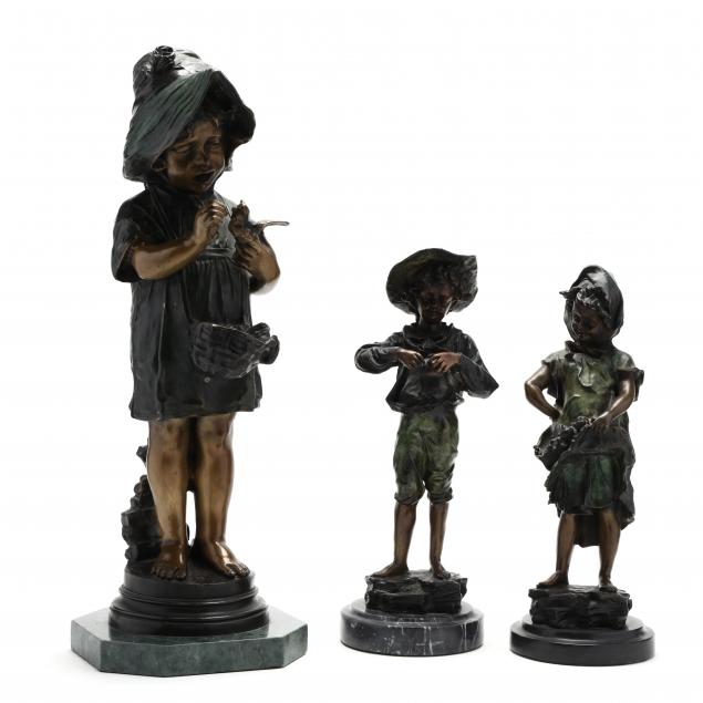 three-bronze-sculptures-of-children