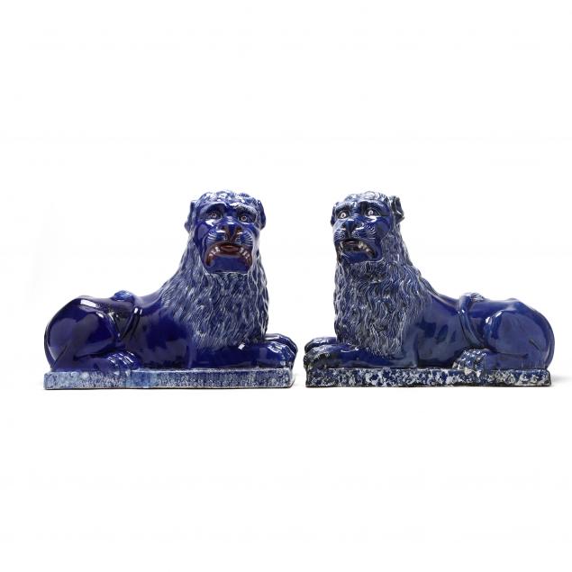 large-and-important-pair-of-faience-guardian-lions