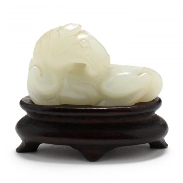a-chinese-jade-carving-of-a-recumbent-horse