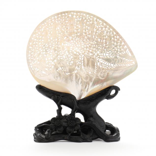 a-chinese-carved-shell-on-stand