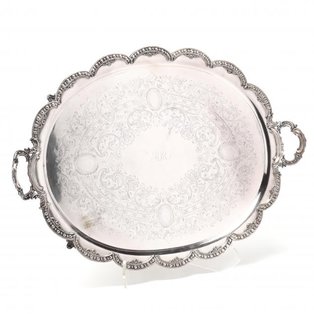 a-large-silver-plated-oval-tray-with-scalloped-rim