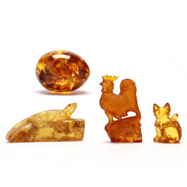 group-of-four-vintage-carved-amber-items
