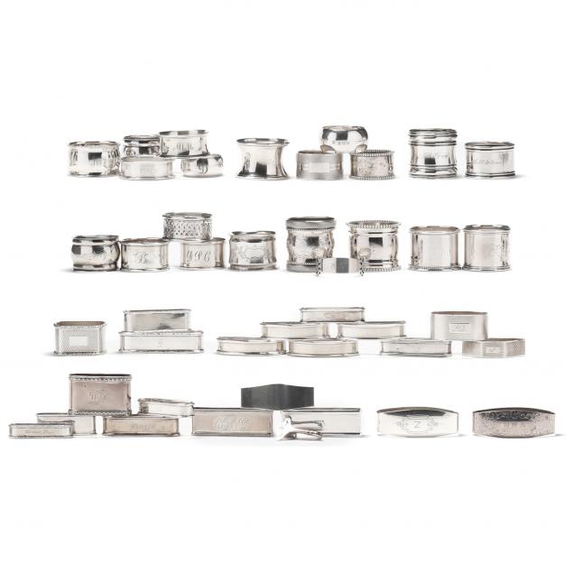 assortment-of-english-and-american-silver-napkin-rings-clips
