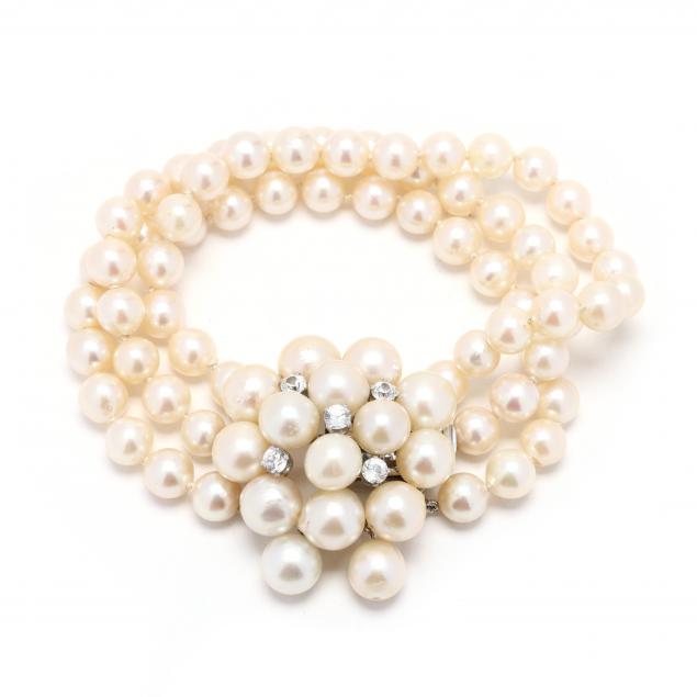 white-gold-and-triple-strand-pearl-bracelet-with-pearl-and-diamond-simulant-clasp