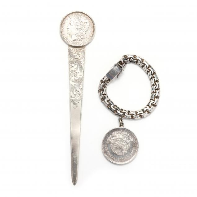 a-letter-opener-with-a-morgan-silver-dollar-mount-and-a-silver-mexican-coin-bracelet