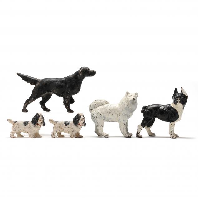 a-collection-of-five-vintage-cast-iron-dog-doorstops