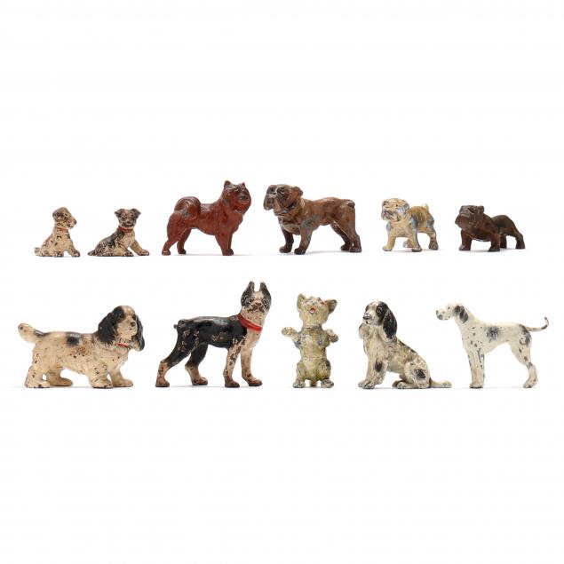 a-collection-of-eleven-vintage-miniature-cast-metal-dog-figurines