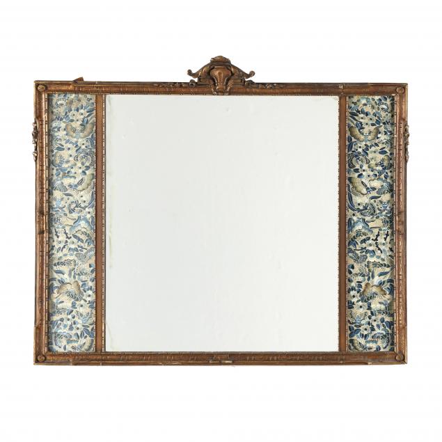 a-chinese-giltwood-wall-mirror-with-embroidered-sleeve-panels