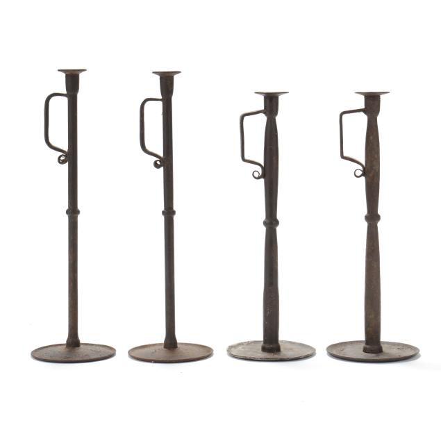 a-set-of-four-vintage-tall-iron-candlesticks