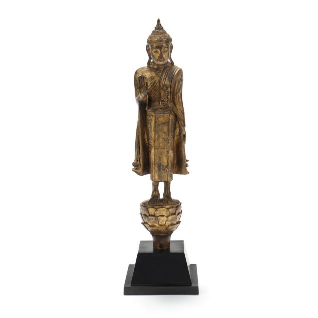 a-southeast-asian-gilt-bronze-standing-buddha-sculpture