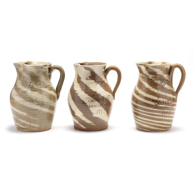 a-set-of-three-generations-of-craig-family-potters-swirl-pitchers