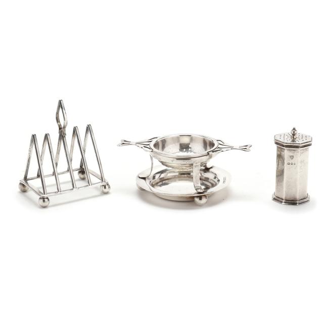 an-english-silver-caster-toast-rack-and-tea-strainer-on-stand