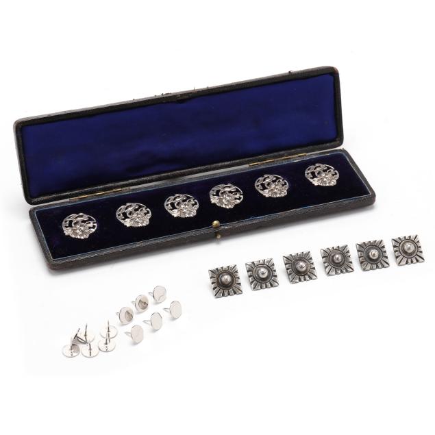 assortment-of-silver-tacks-and-buttons