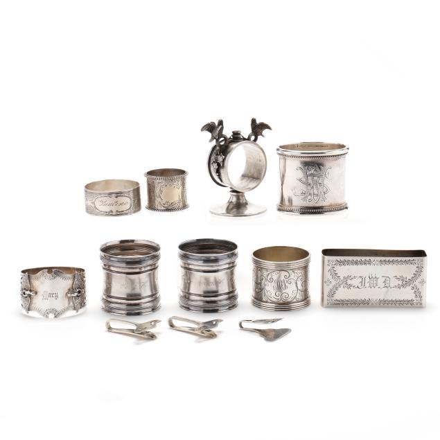 assortment-of-twelve-american-sterling-silver-napkin-rings-and-clips