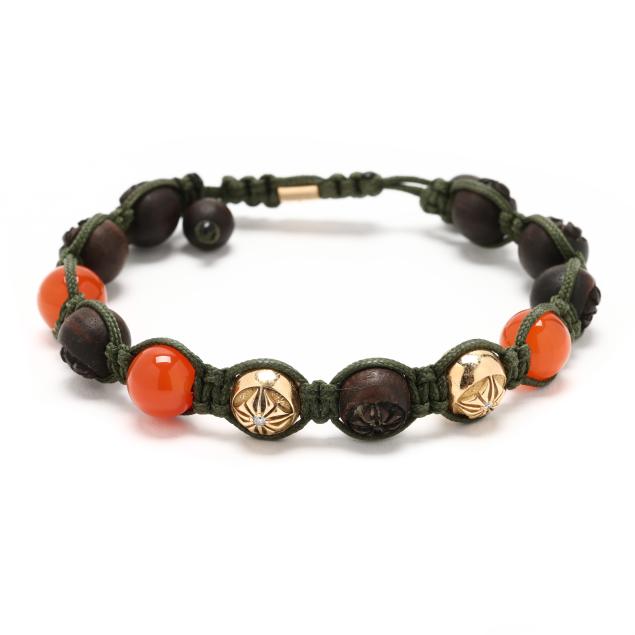 cord-bracelet-with-carnelian-diamond-set-gold-and-carved-wooden-beads