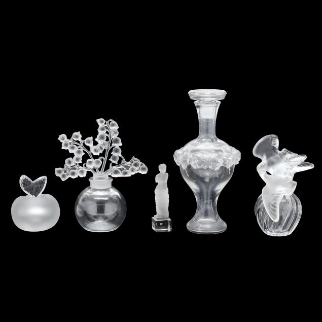 four-lalique-crystal-scent-bottles-and-a-statuette