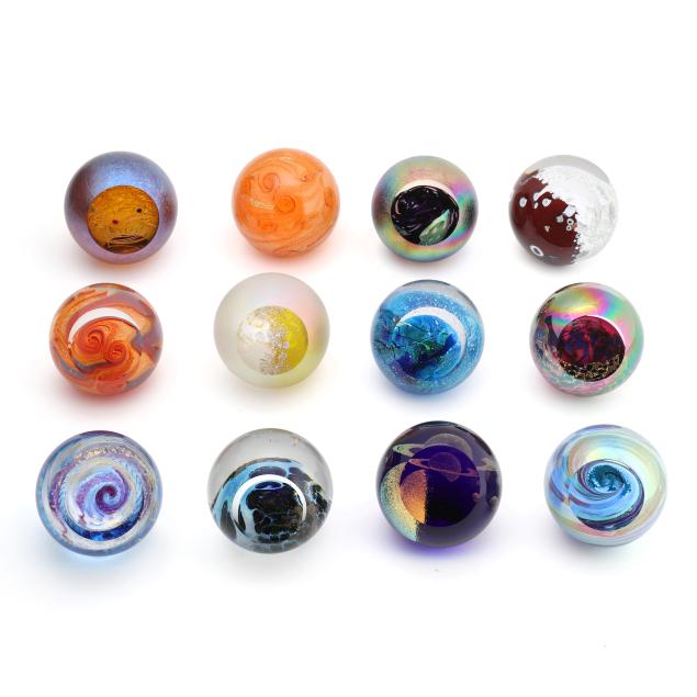 twelve-piece-assembled-universe-collection-of-glass-eye-studio-paperweights