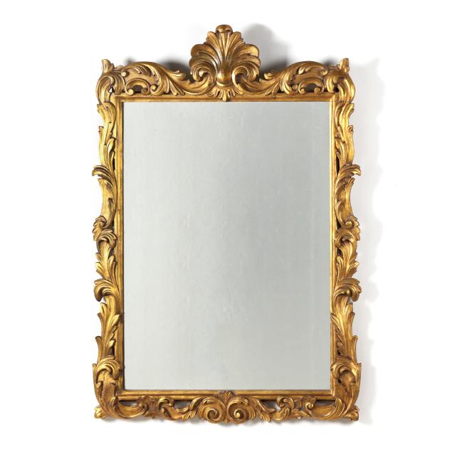 an-italianate-carved-and-gilt-wood-mirror