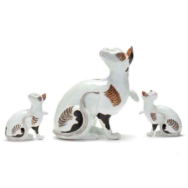 a-set-of-three-french-porcelain-cats