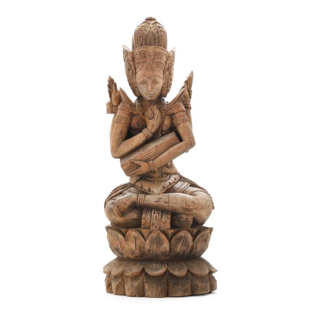 a-southeast-asian-carved-wood-buddhist-deity