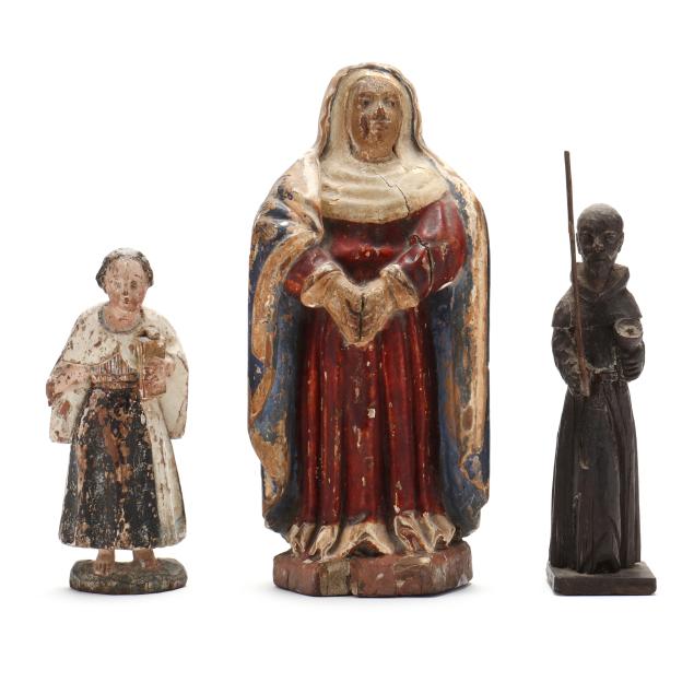 three-carved-religious-santos-figures