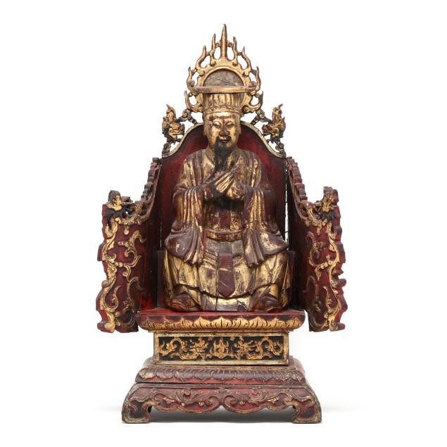 a-chinese-carved-gilt-and-lacquered-wood-deity-on-throne