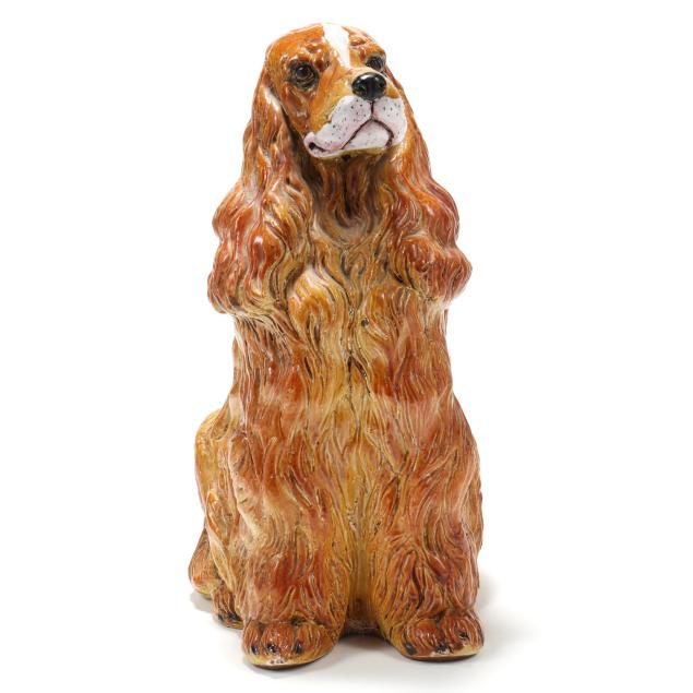 a-large-italian-glazed-terracotta-figure-of-a-spaniel