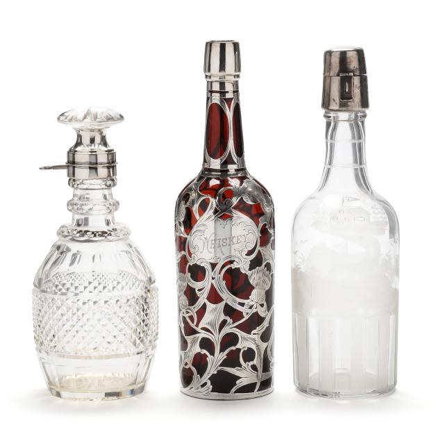 three-fine-vintage-silver-and-glass-decanters