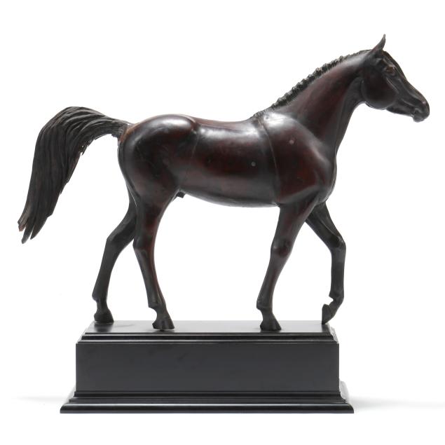 an-antique-carved-model-of-a-horse