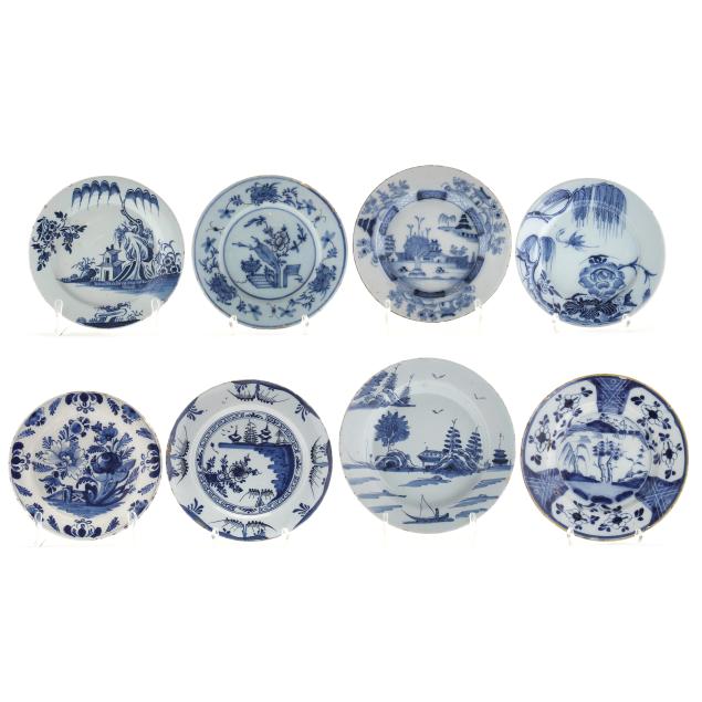 a-group-of-eight-delft-blue-and-white-plates