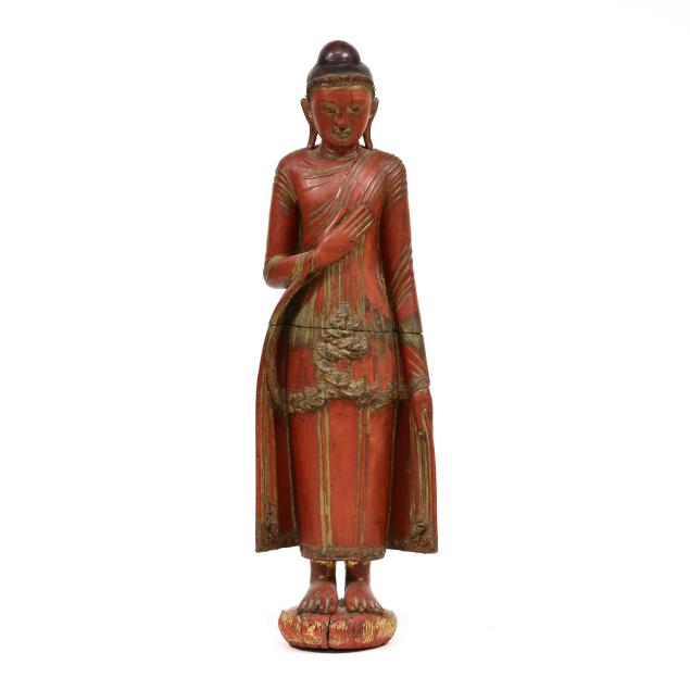 a-large-red-lacquered-sculpture-of-a-standing-buddha