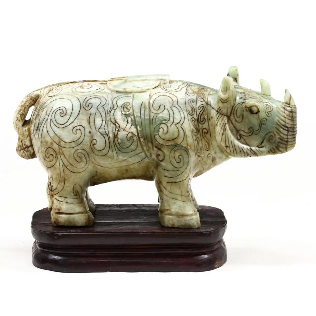 a-large-asian-carved-stone-rhinoceros-sculpture